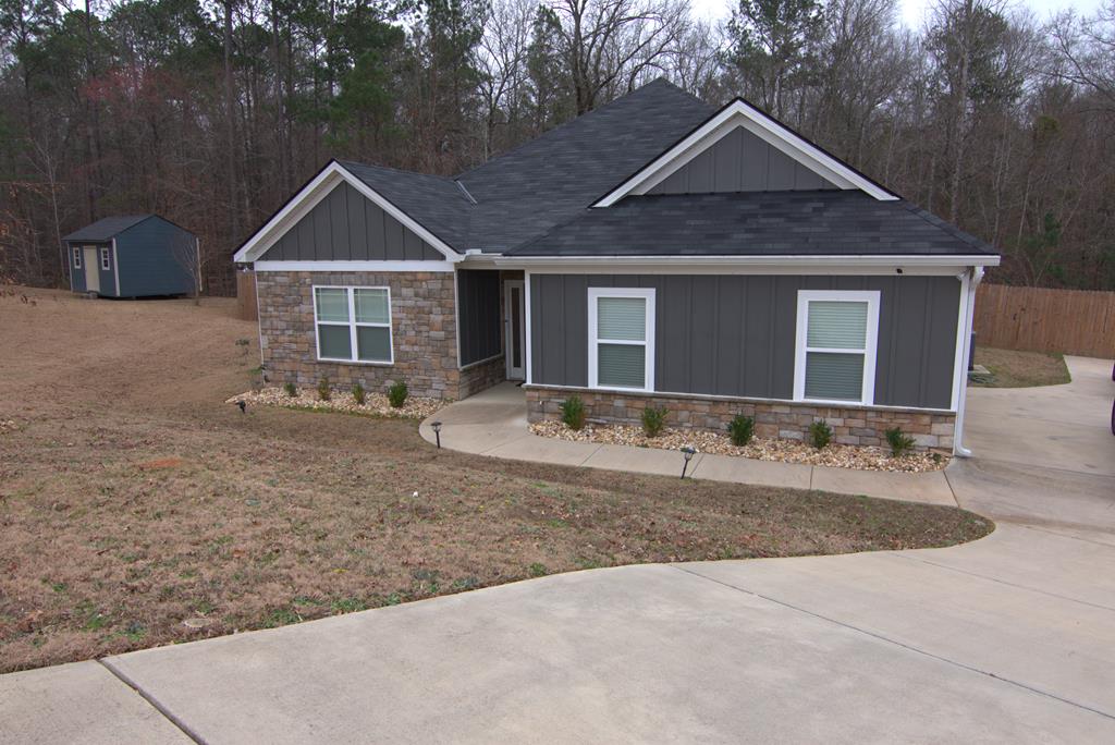 a front view of a house with yard