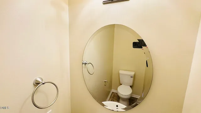 a bathroom with a toilet and a sink
