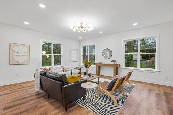 a view of a dining room with furniture and a wooden floor