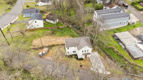 an aerial view of a house with a swimming pool