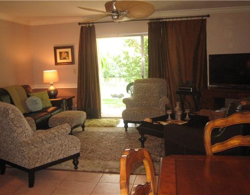 6372 Boca Circle Boca Raton, FL 33433 - Photo 6 of 13 a living room with furniture and a flat screen tv