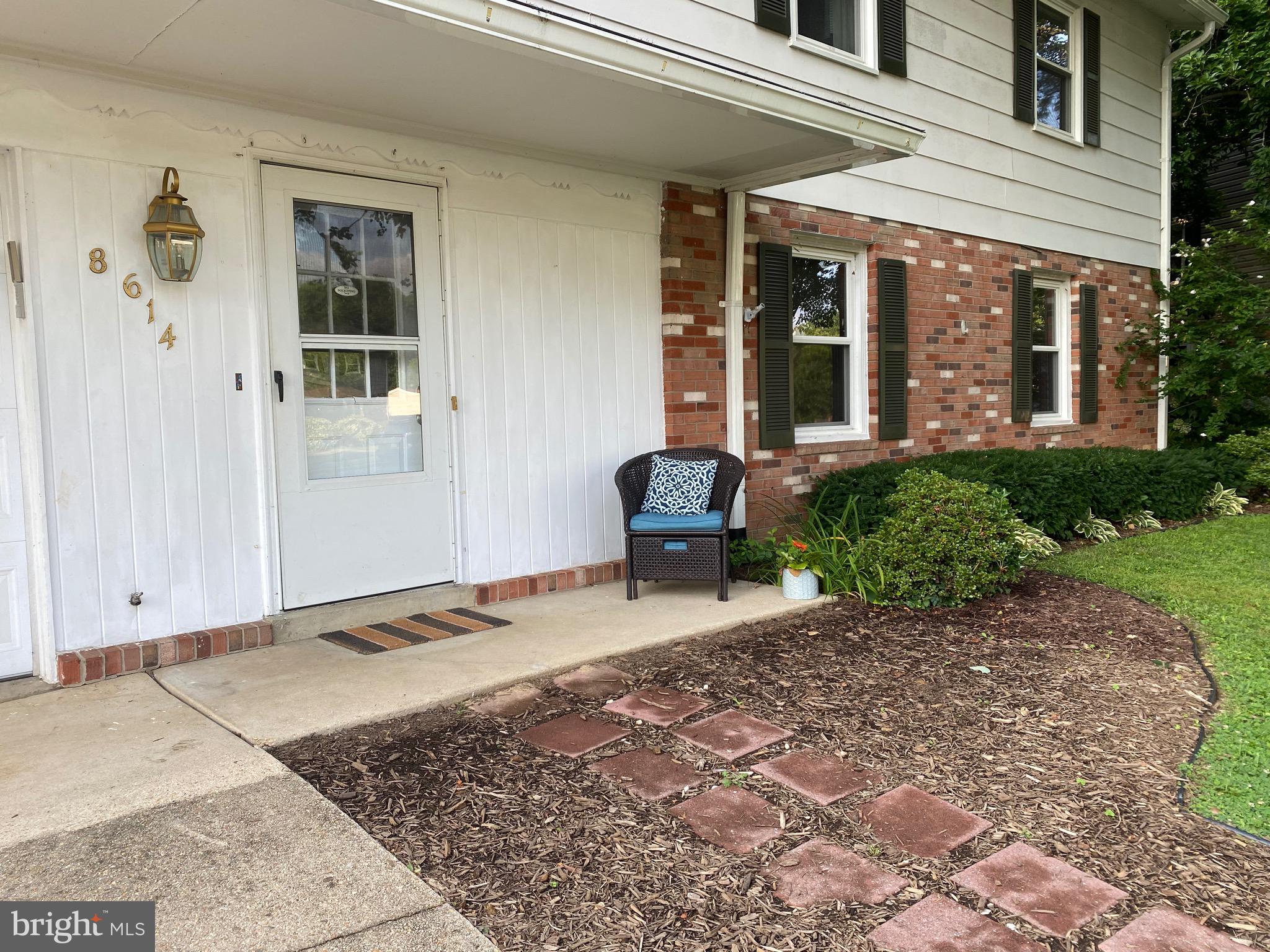 8614 Arley Drive Springfield, VA 22152 - Photo 2 of 24 a view of a patio with a table and chairs and potted plants