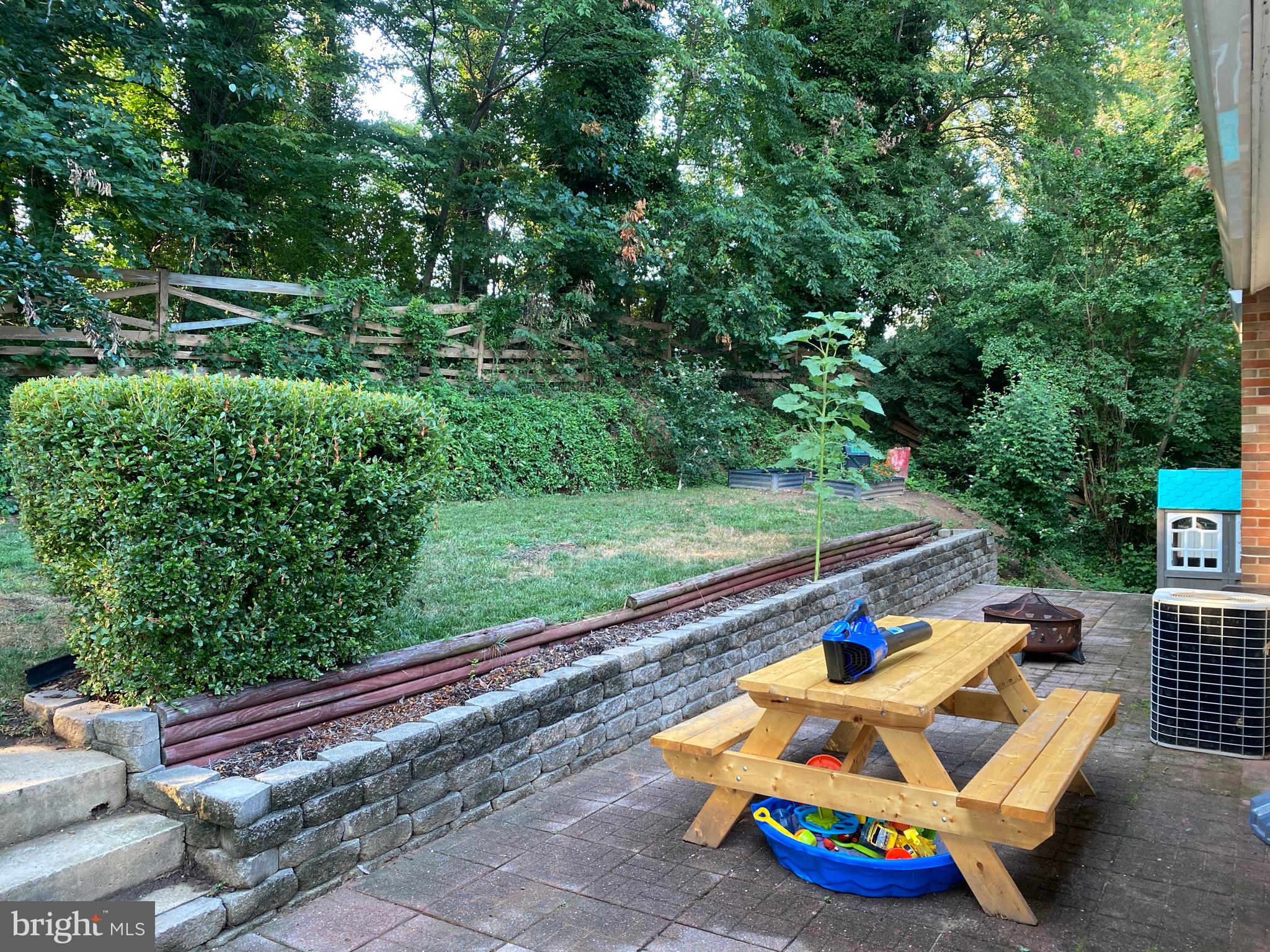 8614 Arley Drive Springfield, VA 22152 - Photo 15 of 24 a small garden covered with tall trees