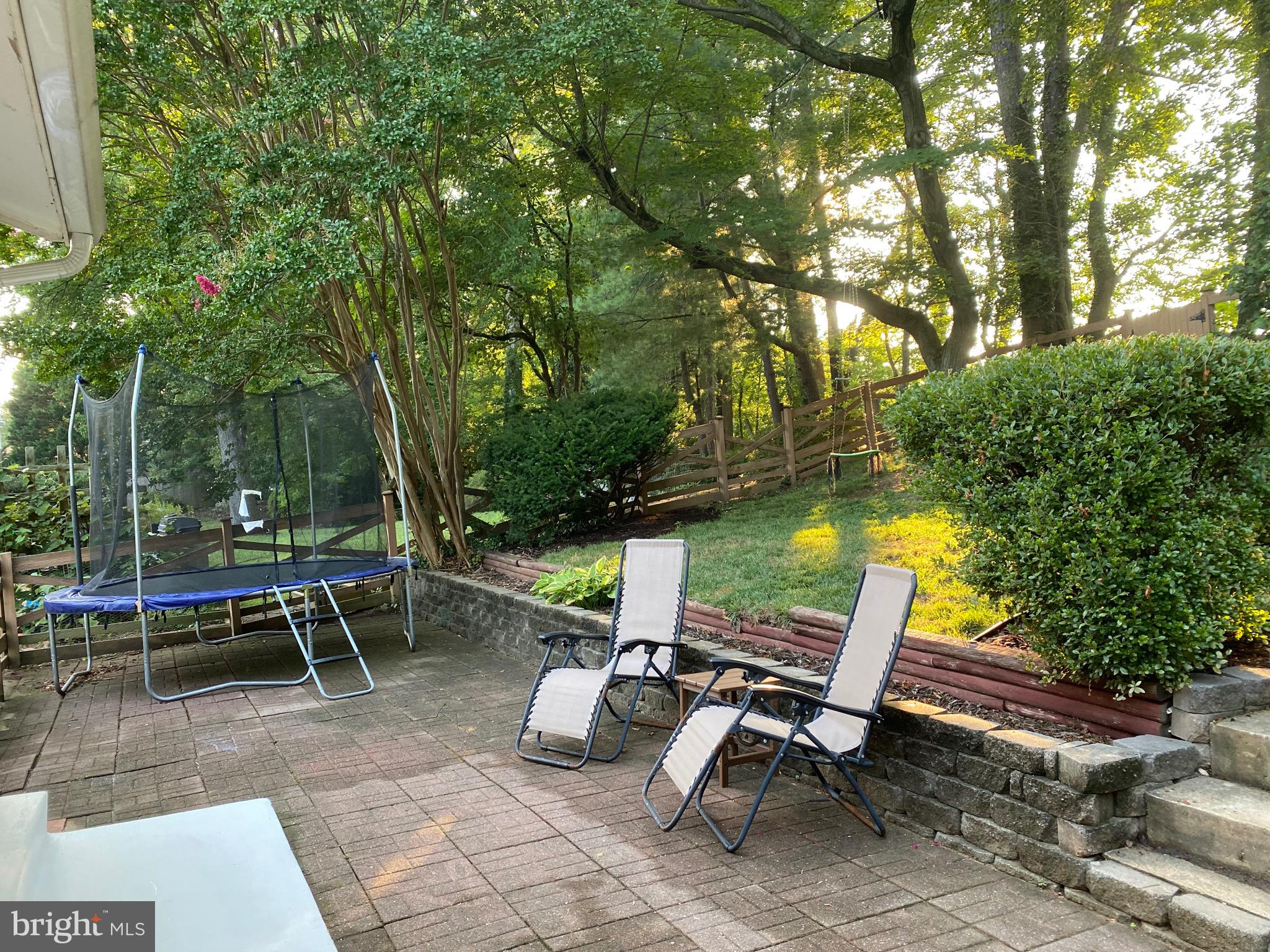 8614 Arley Drive Springfield, VA 22152 - Photo 16 of 24 a view of a backyard with sitting area