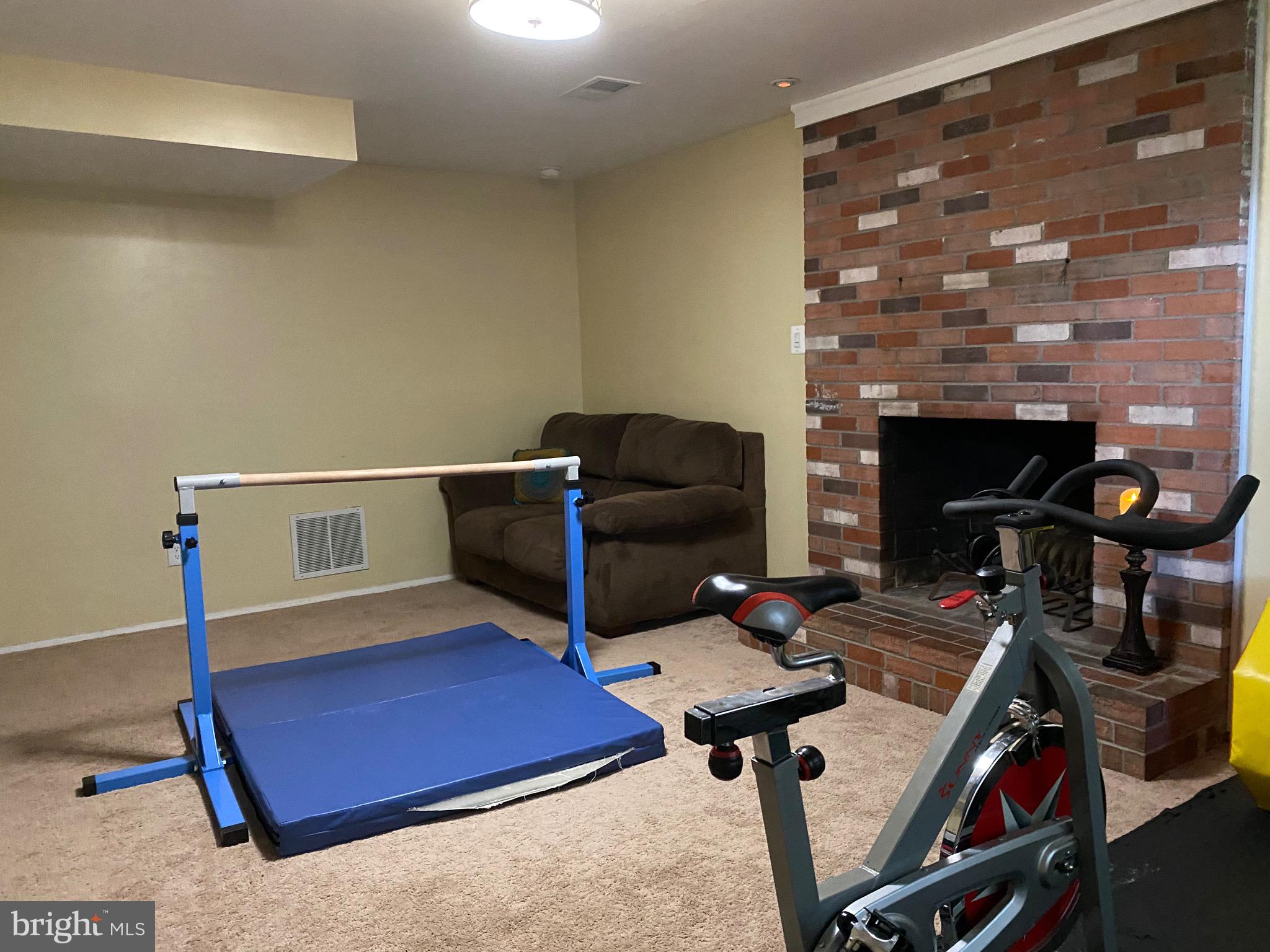 8614 Arley Drive Springfield, VA 22152 - Photo 20 of 24 a living room with furniture and a fireplace