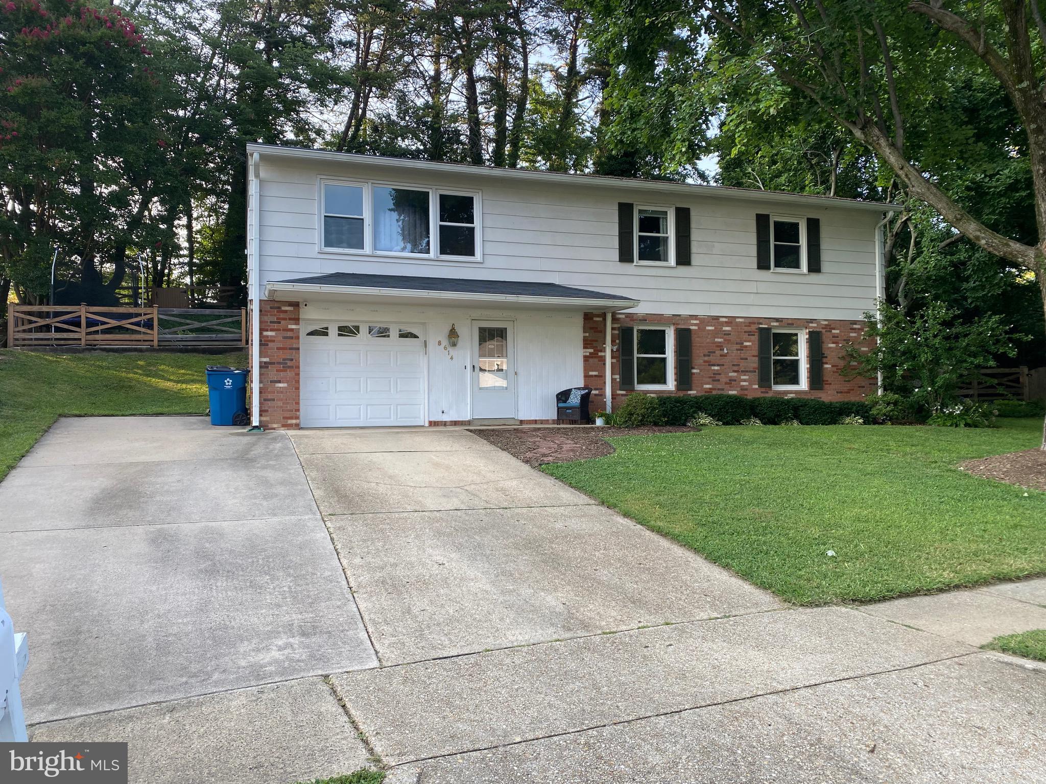 8614 Arley Drive Springfield, VA 22152 - Photo 3 of 24 a front view of house with yard and green space