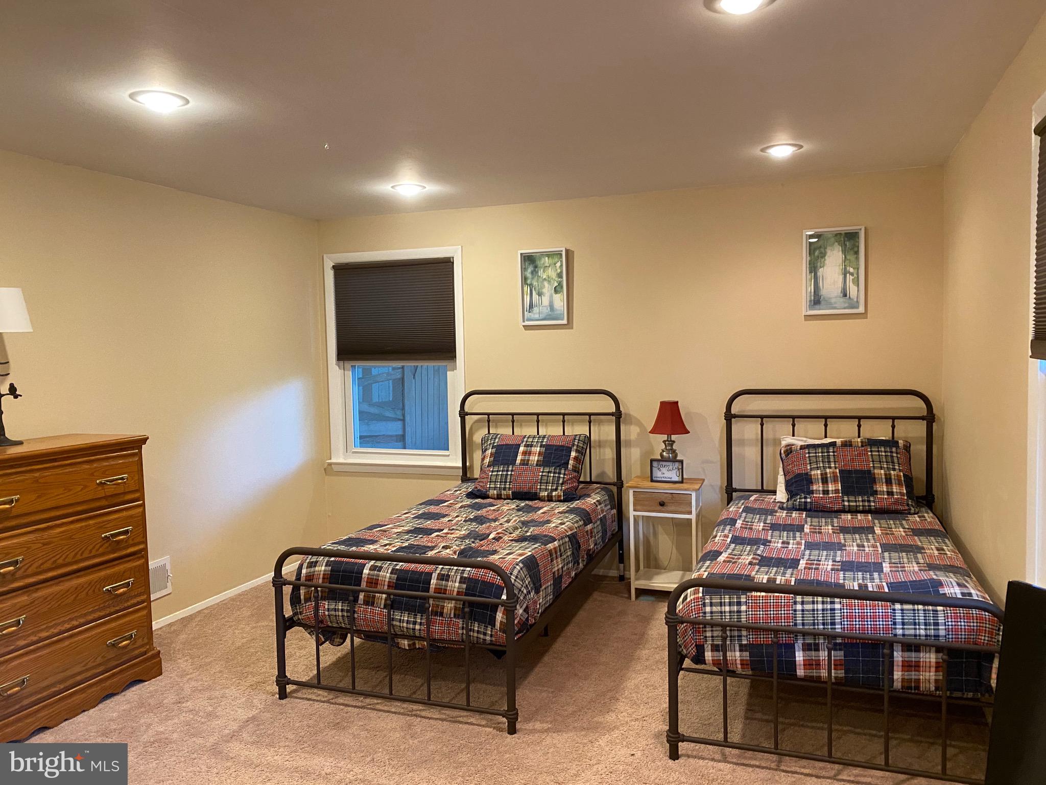 8614 Arley Drive Springfield, VA 22152 - Photo 21 of 24 a bedroom with two beds and painting on the wall