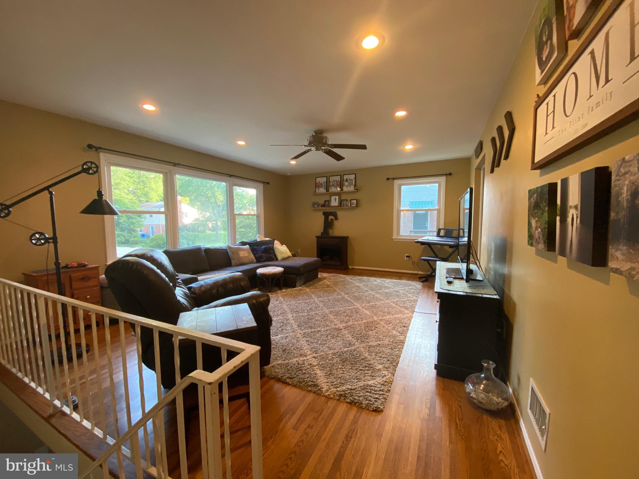 8614 Arley Drive Springfield, VA 22152 - Photo 4 of 24 a living room with furniture and a flat screen tv