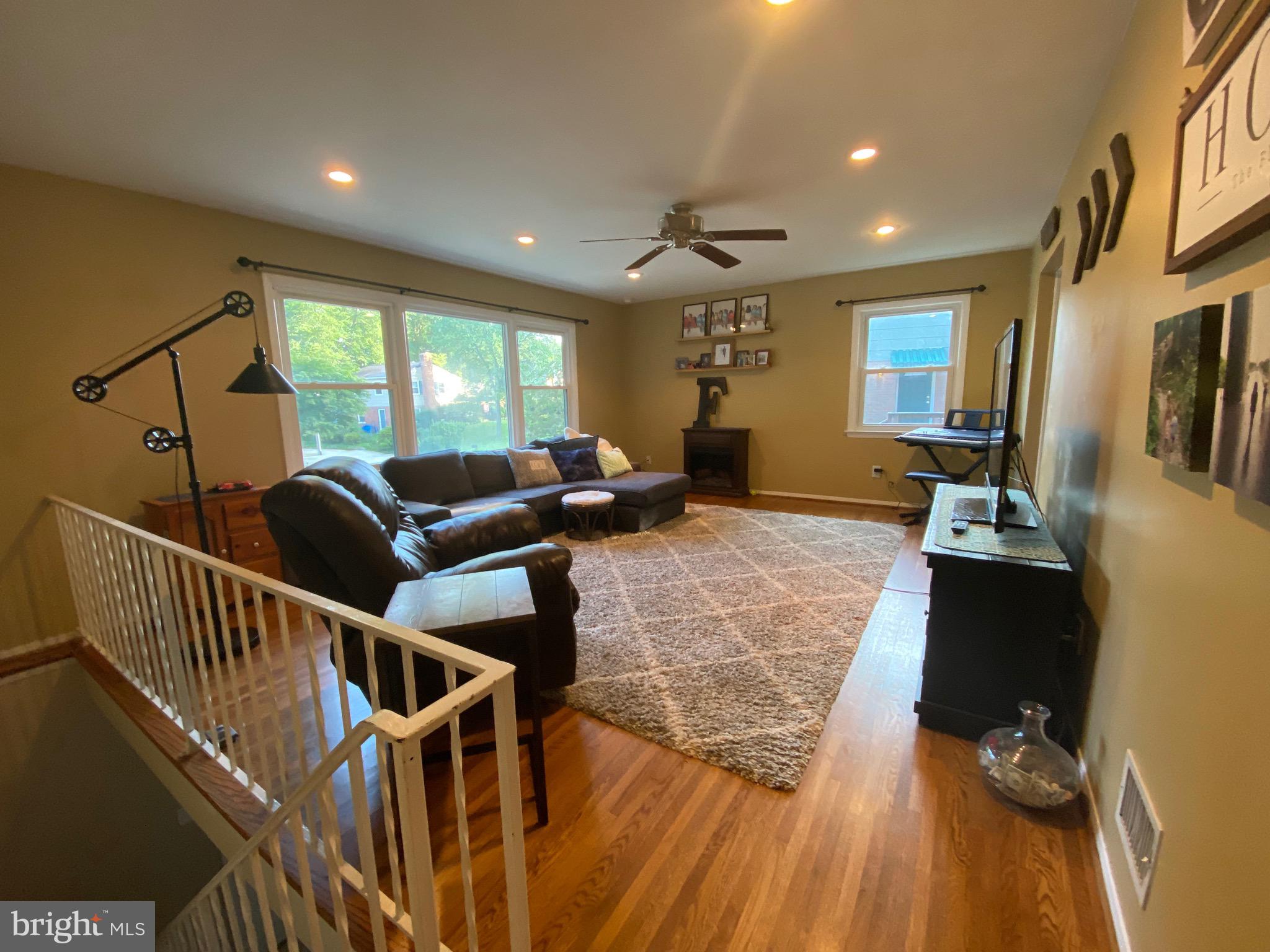 8614 Arley Drive Springfield, VA 22152 - Photo 5 of 24 a living room with furniture windows and a wooden floor
