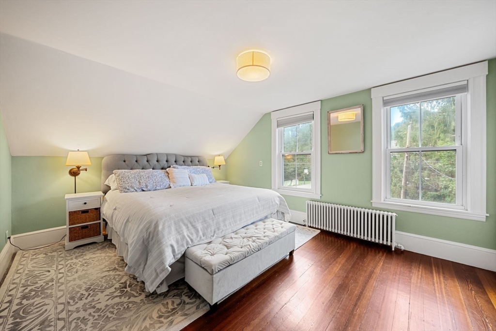 48 Golden Ball Road Weston, MA 02493 - Photo 17 of 21 a bedroom with a bed and wooden floor