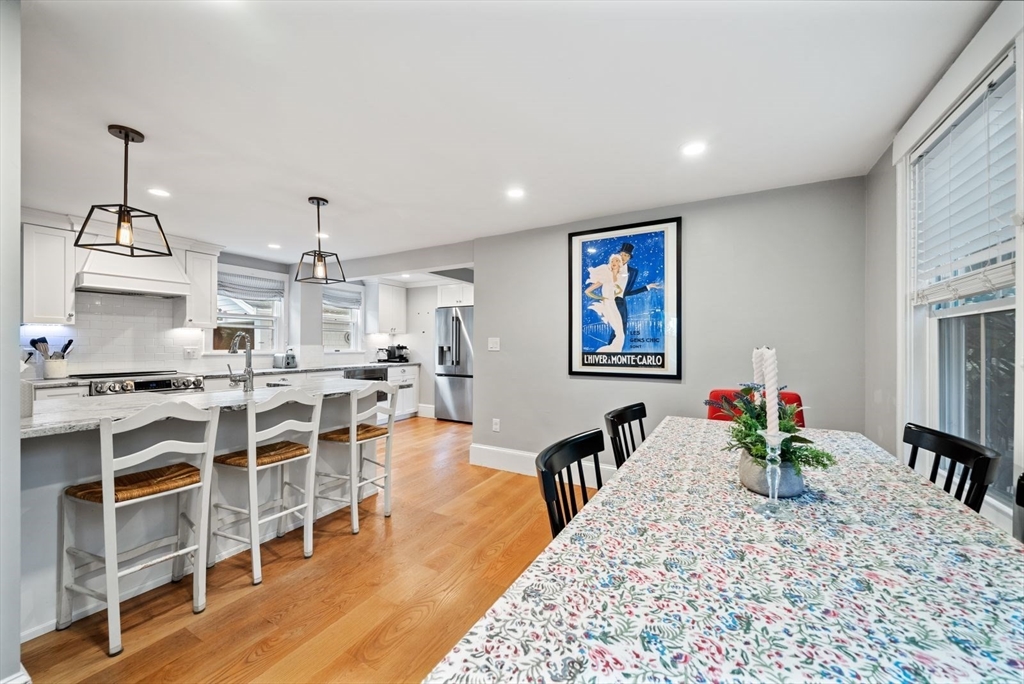 48 Golden Ball Road Weston, MA 02493 - Photo 8 of 21 a view of a dining room with furniture wooden floor and chandelier
