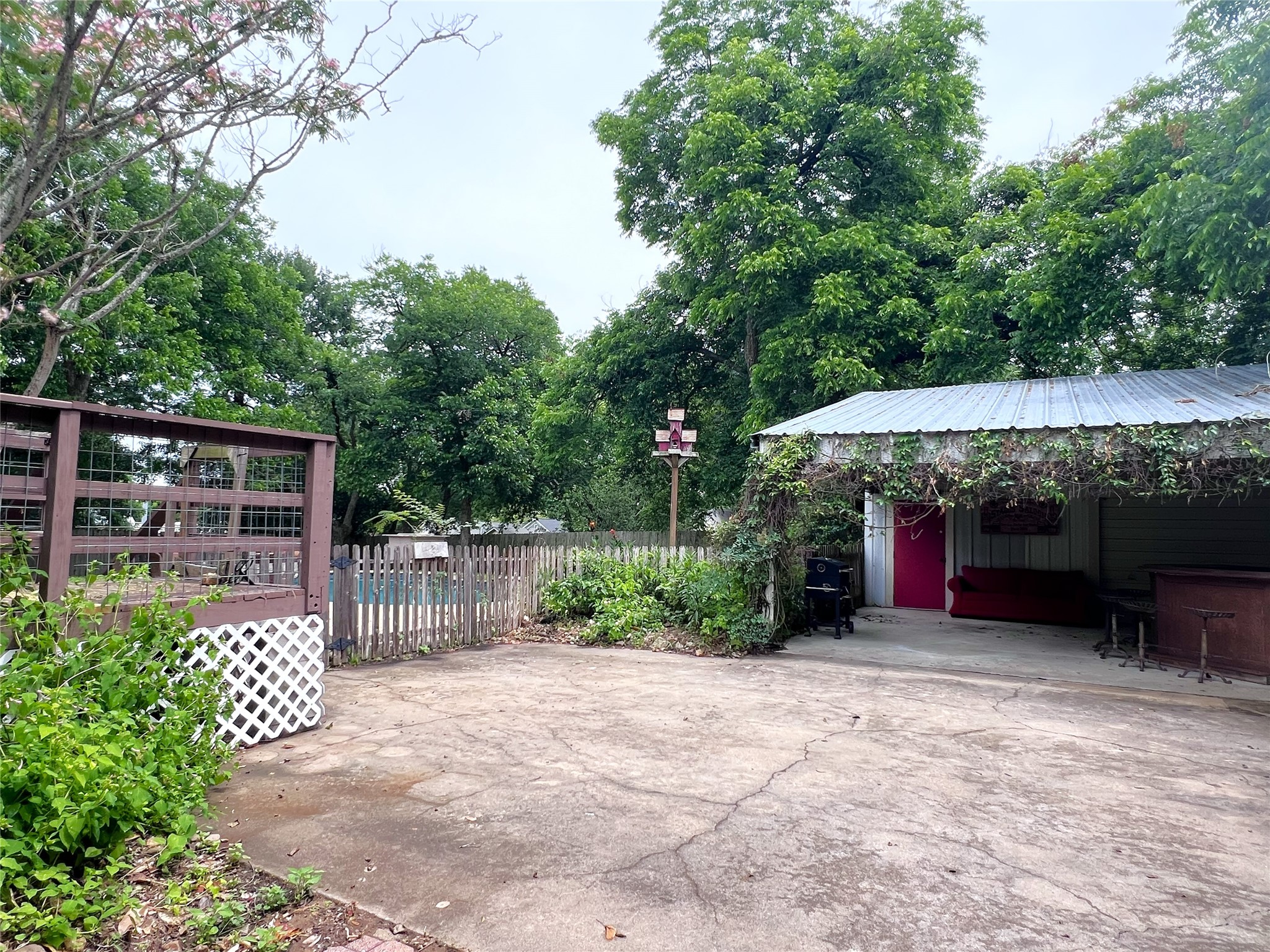 606 Sycamore Street Brenham, TX 77833 - Photo 22 of 27 a view of house with backyard and a patio