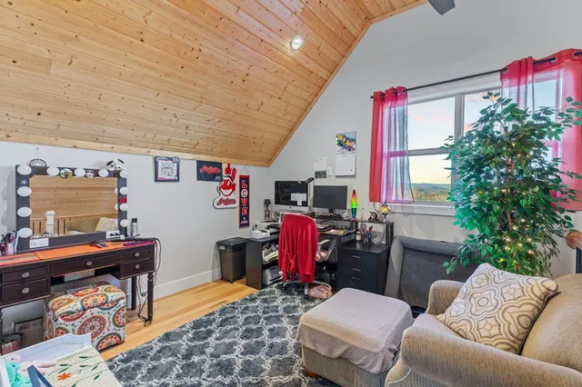 a view of a hallway with furniture