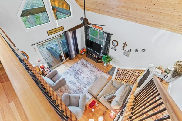 a view of a hallway with furniture