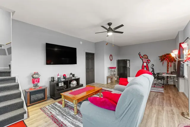 a view of sitting area in balcony with furniture