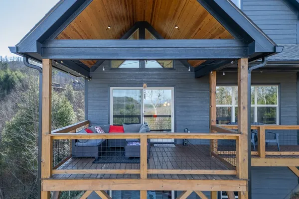 a view of balcony with wooden floor