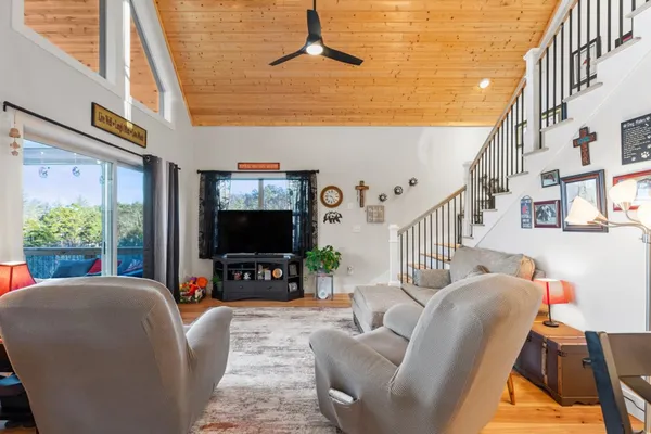 a kitchen with stainless steel appliances granite countertop a refrigerator sink stove and microwave