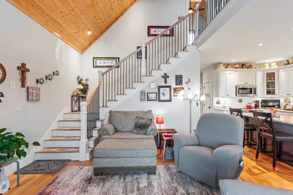 a kitchen with stainless steel appliances granite countertop a stove microwave and cabinets
