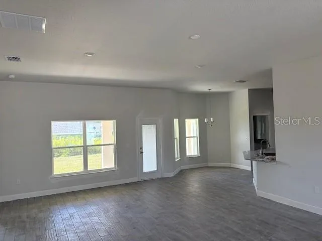 a view of livingroom and window with wooden floor