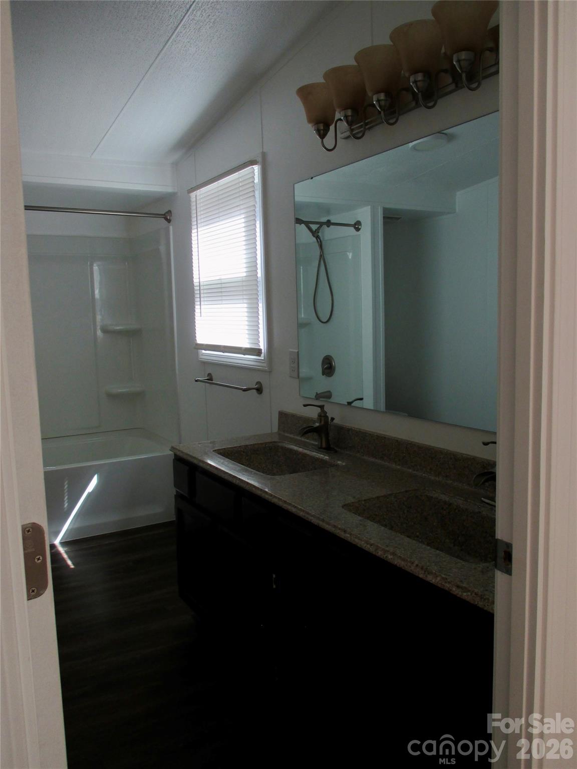 5714 Tipton Road Monroe, NC 28112 - Photo 14 of 26 a bathroom with a sink and mirror