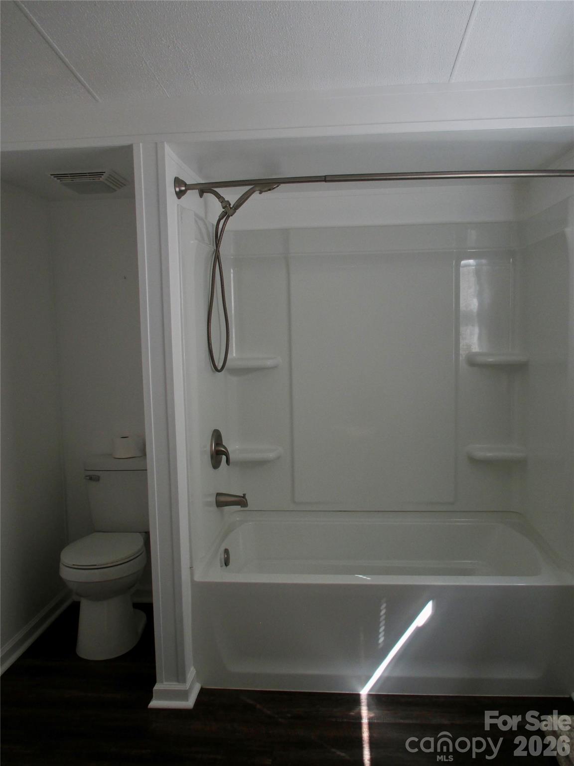5714 Tipton Road Monroe, NC 28112 - Photo 16 of 26 a bathroom with a bathtub and a toilet