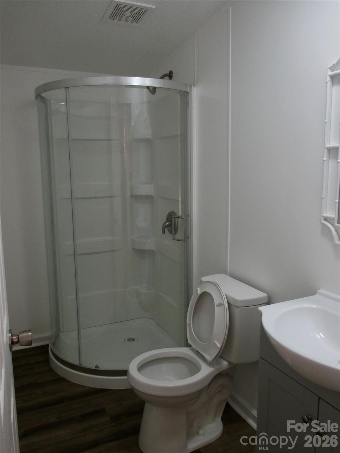 5714 Tipton Road Monroe, NC 28112 - Photo 18 of 26 a bathroom with a toilet and a shower