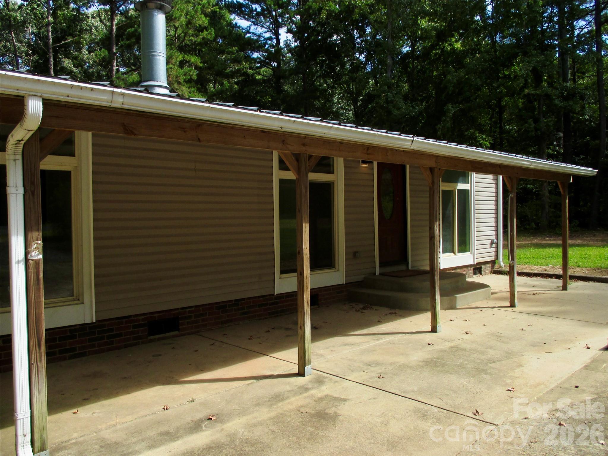 5714 Tipton Road Monroe, NC 28112 - Photo 2 of 26 a view of a house with backyard