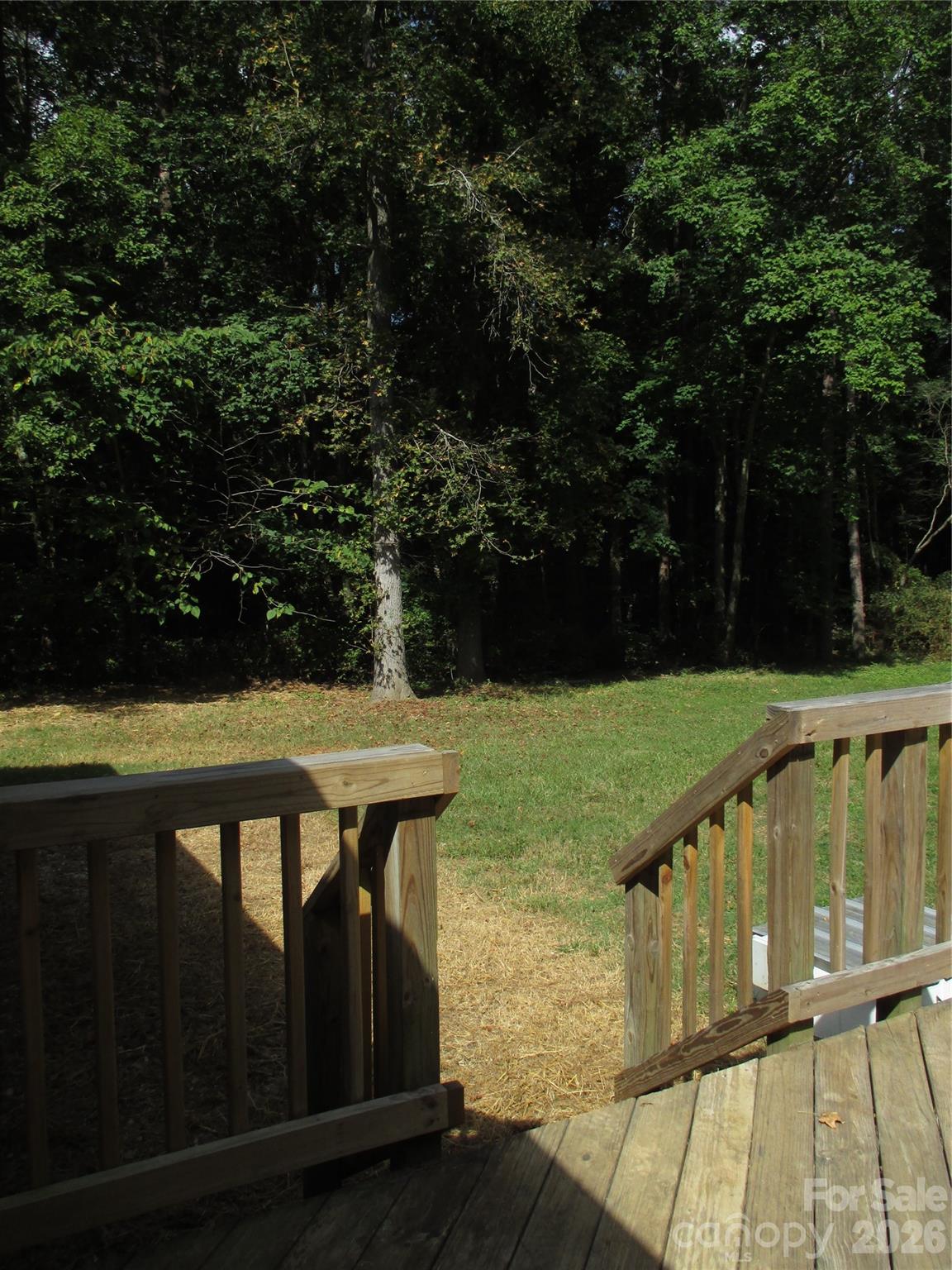5714 Tipton Road Monroe, NC 28112 - Photo 21 of 26 a view of a balcony with wooden floor and outdoor space