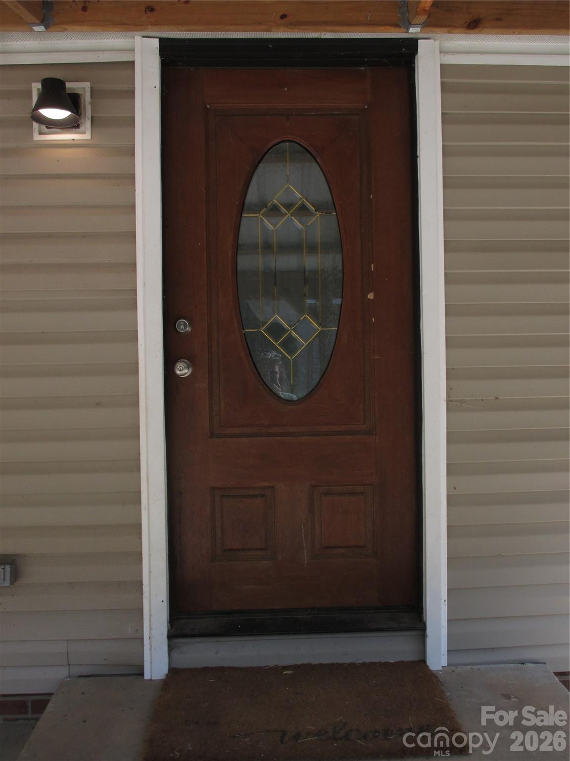 5714 Tipton Road Monroe, NC 28112 - Photo 6 of 26 a front view of a house with a wooden door