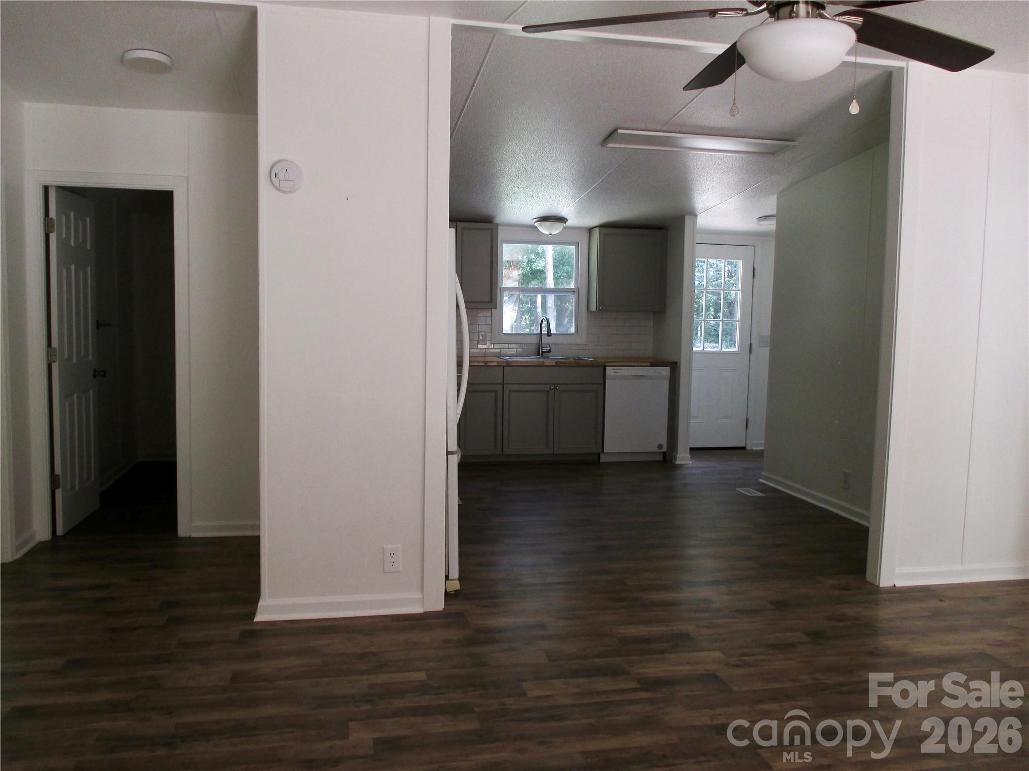 5714 Tipton Road Monroe, NC 28112 - Photo 8 of 26 a view of an empty room with window and wooden floor