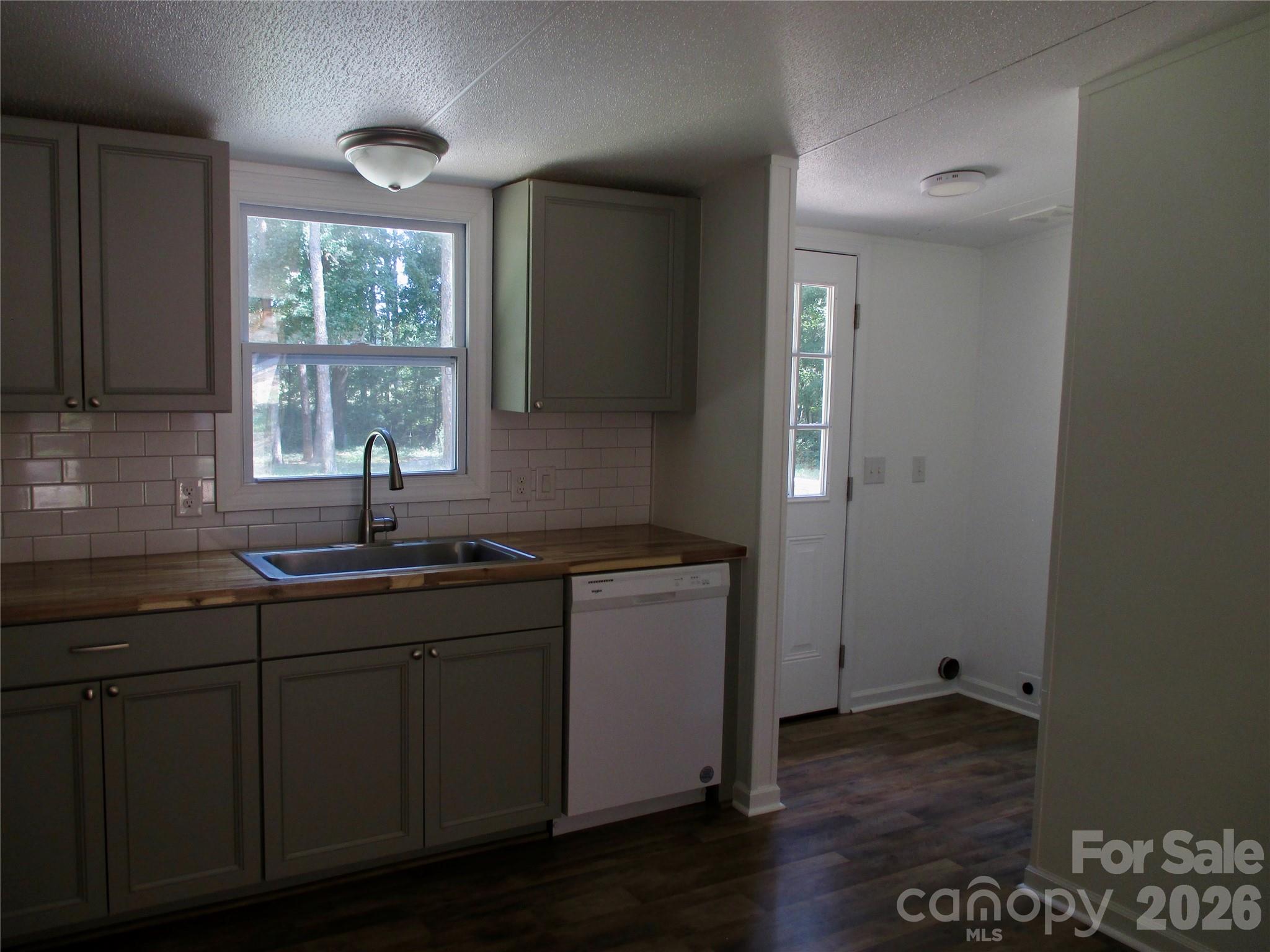 5714 Tipton Road Monroe, NC 28112 - Photo 10 of 26 a kitchen with sink and window