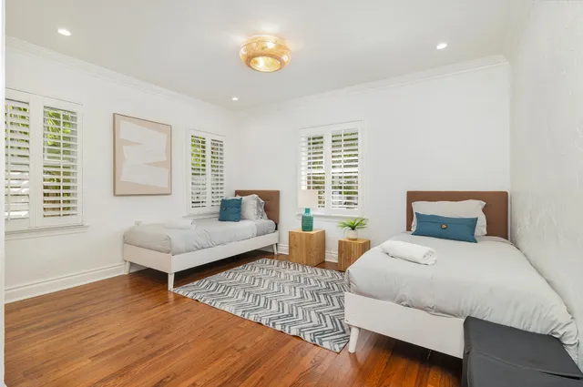 a bedroom with a bed and a couch