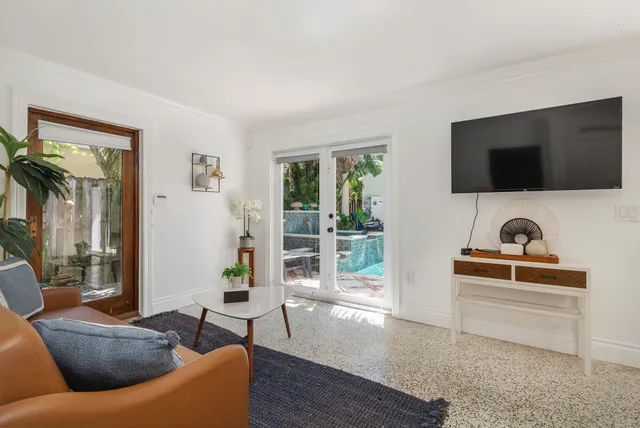 a living room with furniture and a flat screen tv