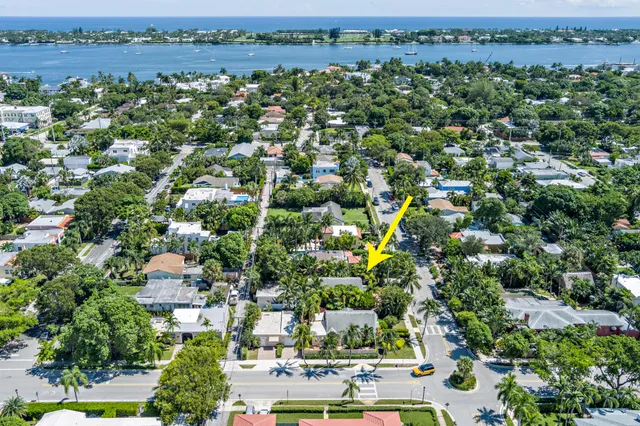 an aerial view of residential building with outdoor space and trees