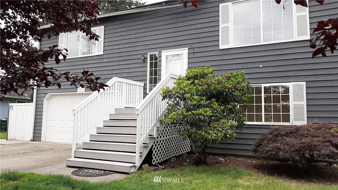 333 East Springfield Loop Shelton, WA 98584 - Photo 2 of 27 a front view of a house with a garden
