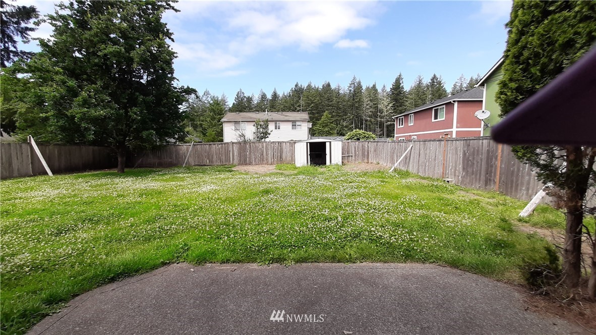 333 East Springfield Loop Shelton, WA 98584 - Photo 12 of 27 a view of a backyard with a small cabin