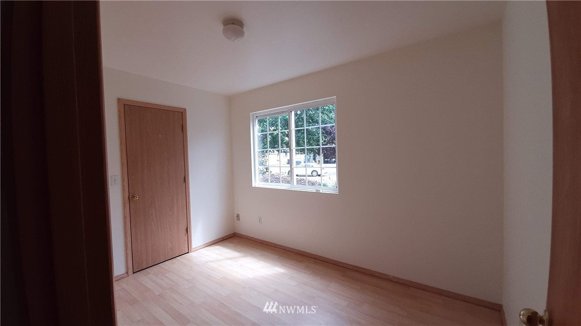 333 East Springfield Loop Shelton, WA 98584 - Photo 19 of 27 a view of an empty room with wooden floor and a window