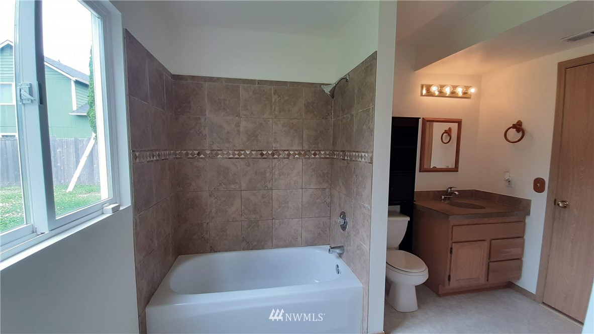 333 East Springfield Loop Shelton, WA 98584 - Photo 21 of 27 a bathroom with a granite countertop bathtub shower sink vanity and toilet