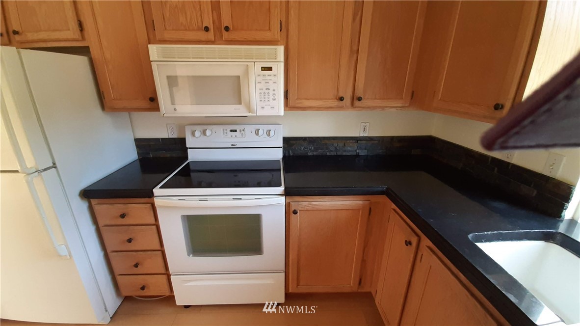 333 East Springfield Loop Shelton, WA 98584 - Photo 10 of 27 a kitchen with a stove microwave and sink
