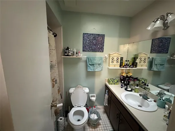 a bedroom with furniture and window