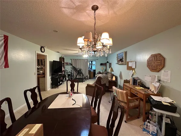 a very nice looking dining room with a table and chairs
