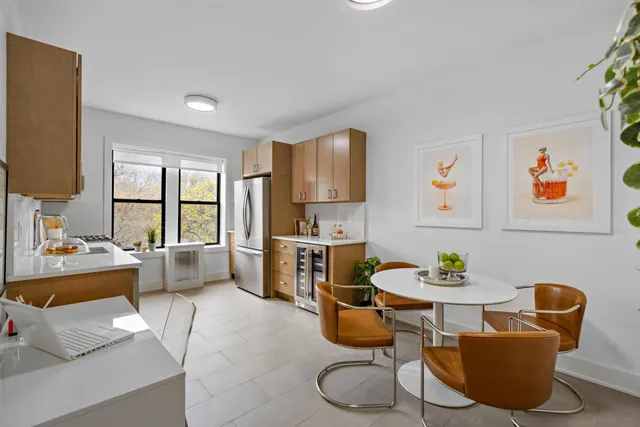 a living room with furniture a rug and a large window