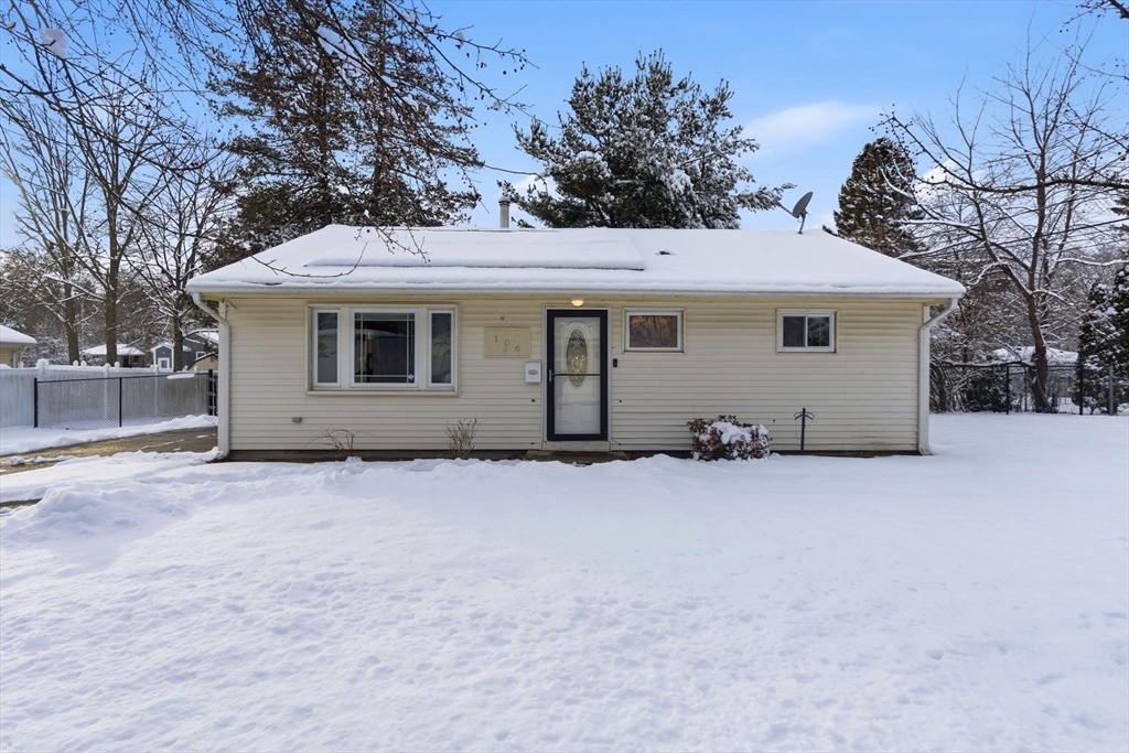106 Baldwin Avenue Framingham, MA 01701 - Photo 13 of 13 a house with trees in the background