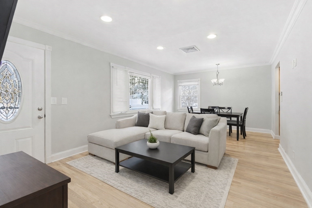 106 Baldwin Avenue Framingham, MA 01701 - Photo 2 of 13 a living room with furniture and a couch