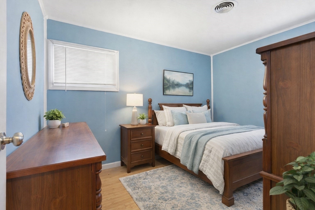106 Baldwin Avenue Framingham, MA 01701 - Photo 6 of 13 a bedroom with a bed and a desk