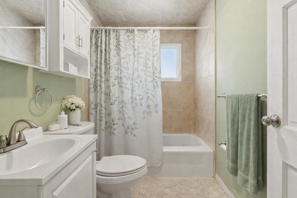 106 Baldwin Avenue Framingham, MA 01701 - Photo 8 of 13 a bathroom with a sink toilet and shower
