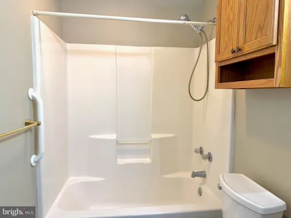 a bathroom with a shower and a tub