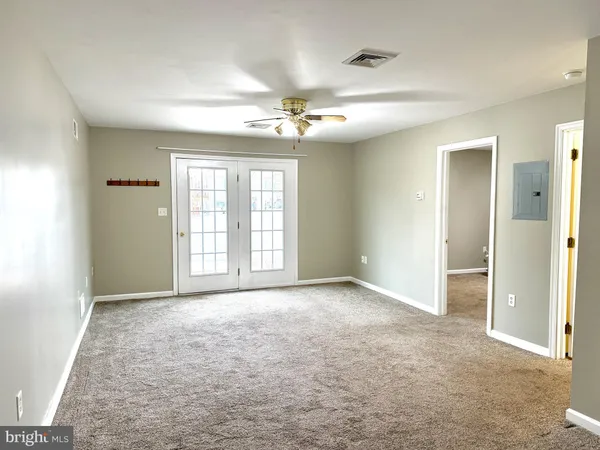 a view of an empty room with a window