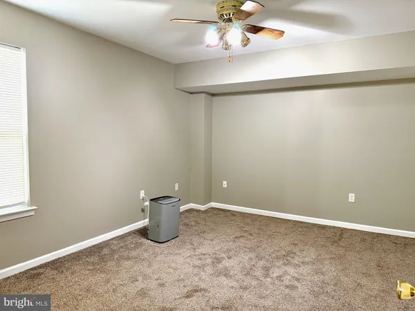 a view of a small space with a fan