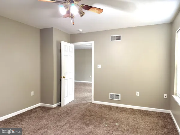 an empty room with a bathroom